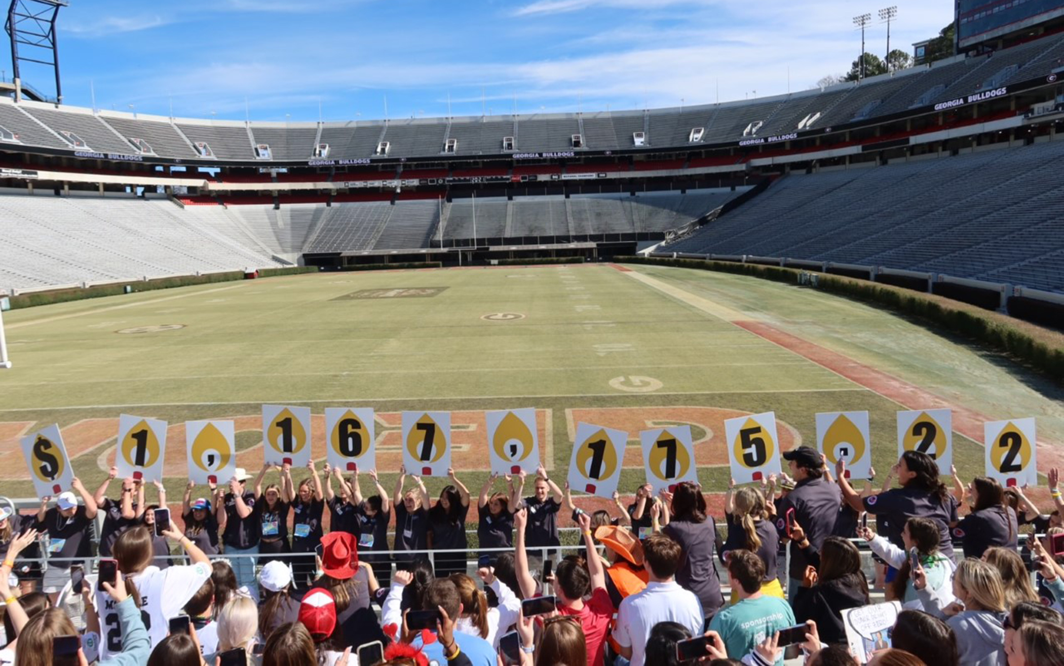 Multiple students at the Sanford Stadium.