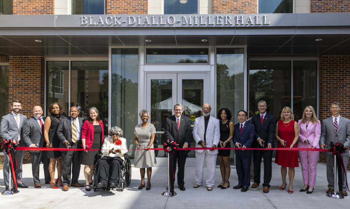A ribbon being cut to celebrate Black-Diallo-Miller Hall.