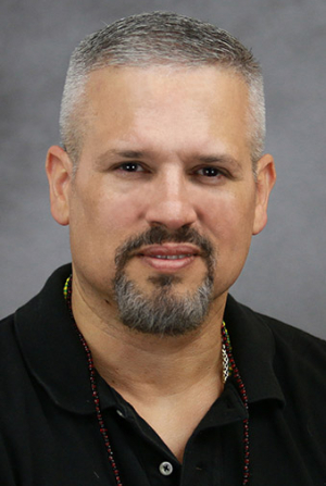 John Alvarez Turner's headshot.