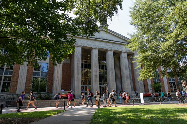 A UGA building with students walking outside.