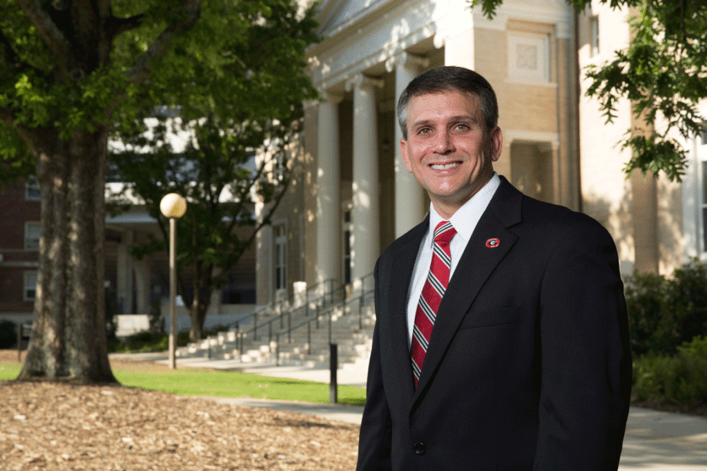 Eric Atkinson with Memorial Hall behind him.