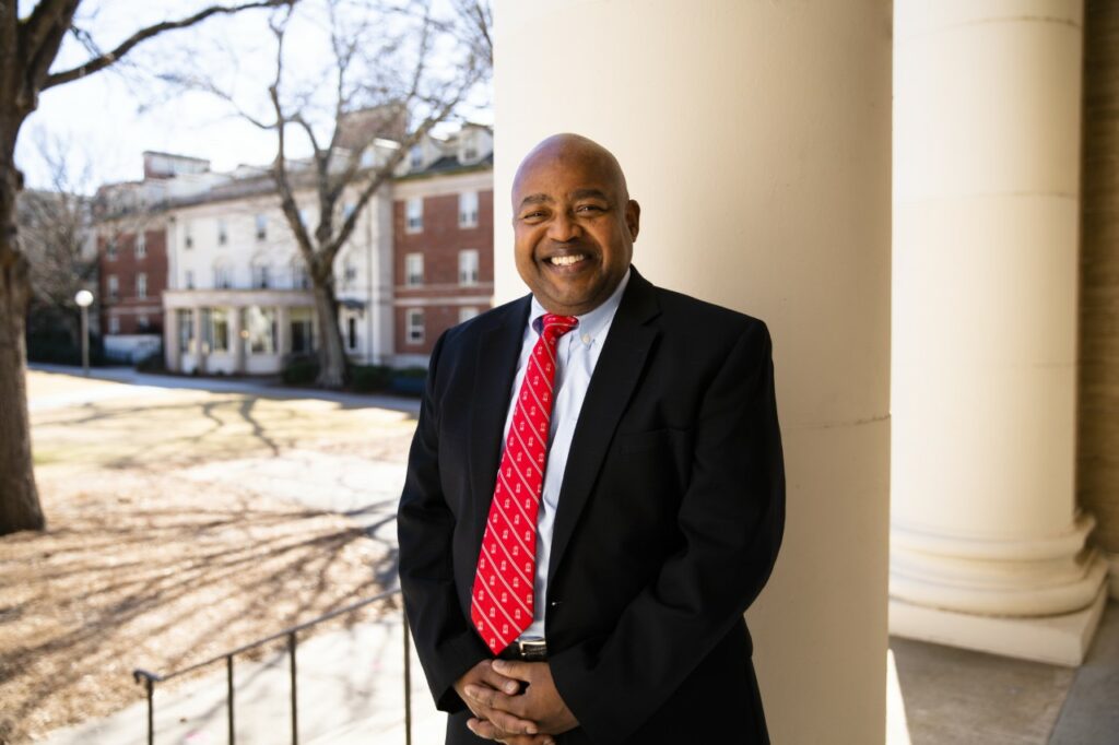 Photograph of Victor Wilson in front of Memorial Hall.