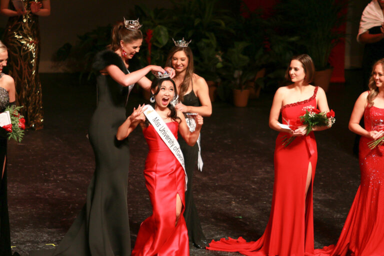 Sarah Park smiling ecstatically as she is crowned Miss UGA 23