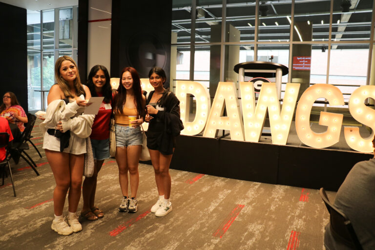 Four female students posing for photo at Transfer Student Welcome