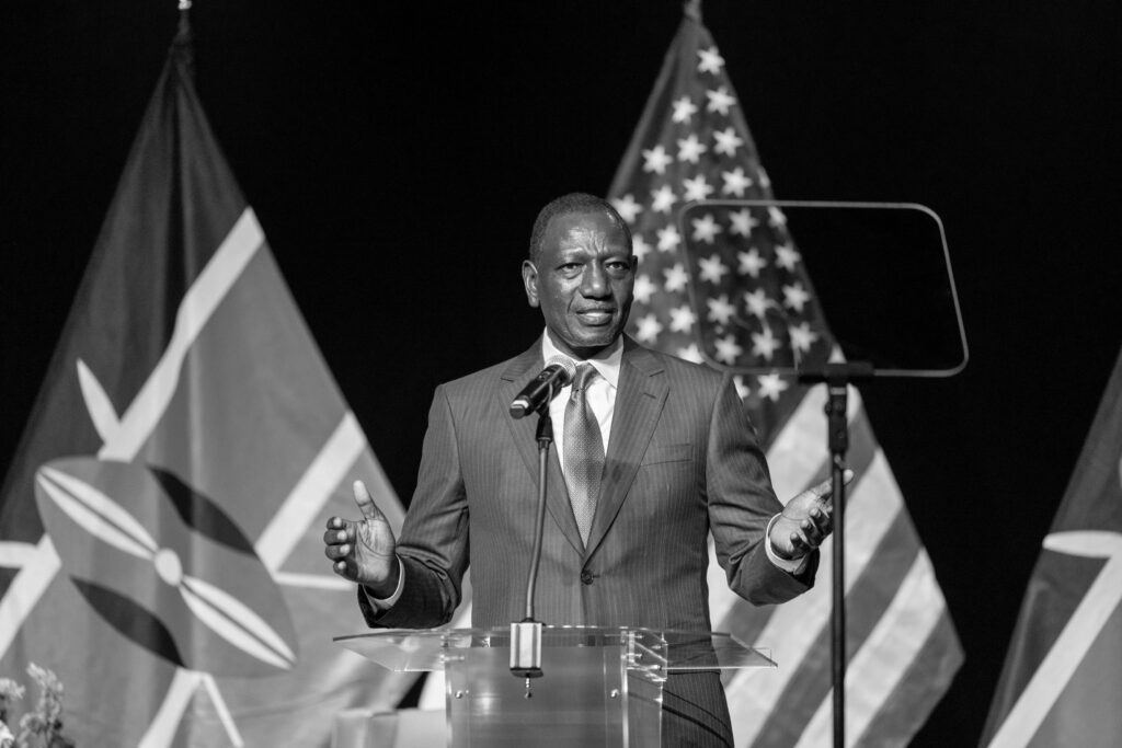 black and white photo of President Ruto speaking.