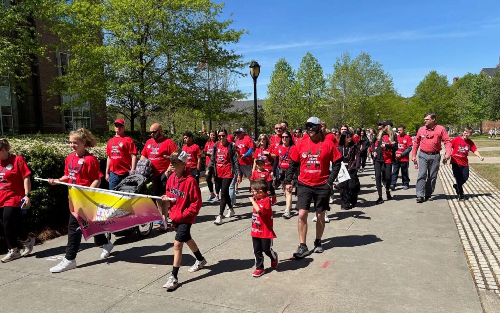 People walking on campus during the Out of Darkness Campus Walk event.