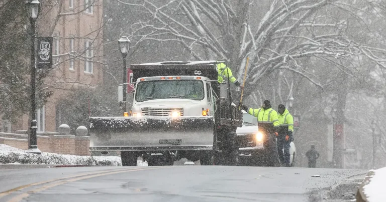 Crews clear the roads on South Campus during a snow day in Athens.