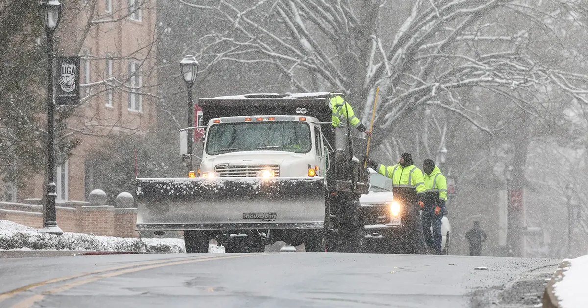 Crews clear the roads on South Campus during a snow day in Athens.