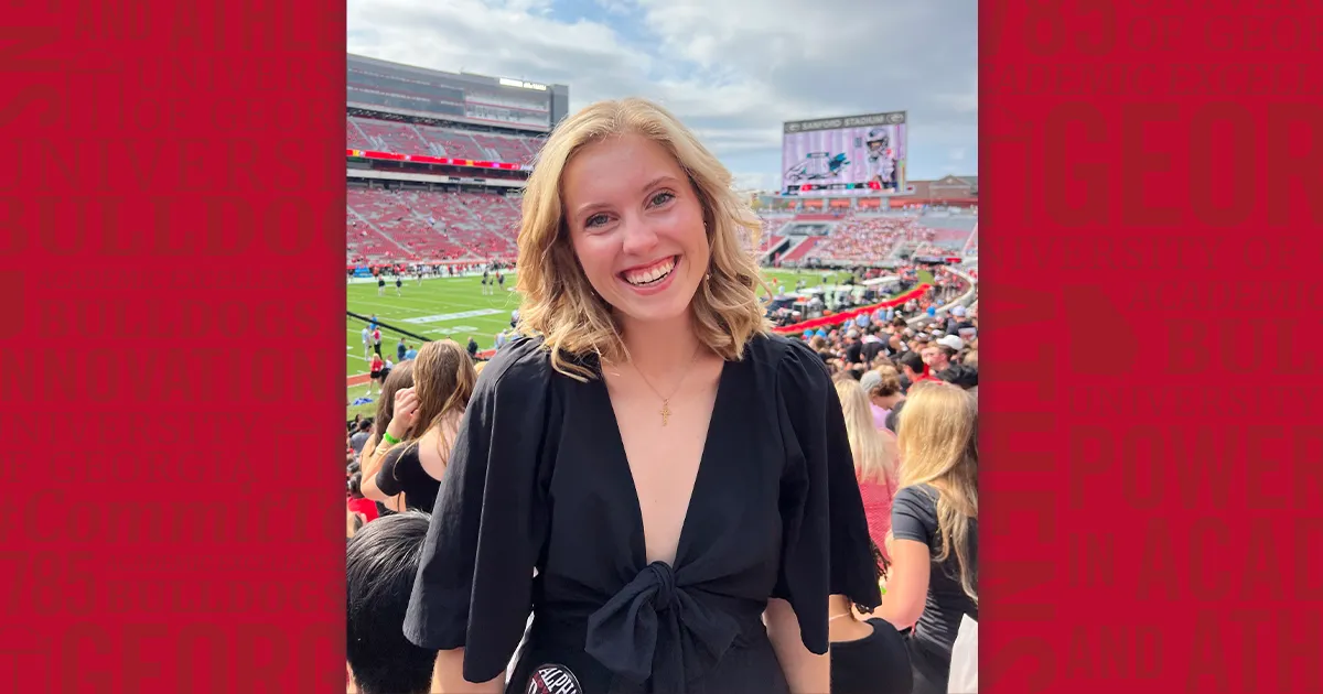 Erin Mattson at Sanford Stadium with a decorative background in the back.