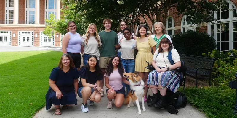 Disability ambassadors smile for a photo alongside program facilitators, Dr. Brandy Walker and Emmie Gooch. Photo by Maya Koluder-Ramirez.
